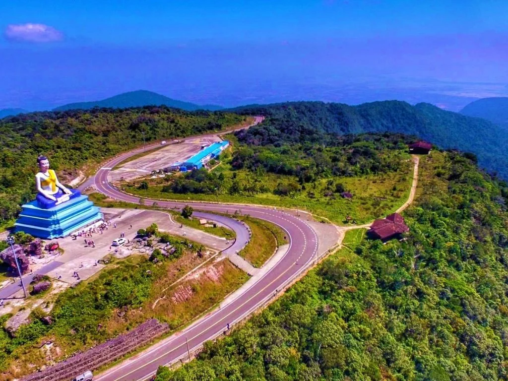 Private Bokor National Park day tour from Phnom Penh, featuring misty mountains, waterfalls, and historic French colonial buildings