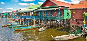 Tonle Sap floating village boat tour with local houses on stilts and scenic views, part of a private Siem Reap city and cultural day tour.