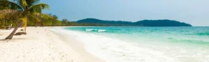 Travelers enjoying sunset on Koh Rong Island after exploring Angkor Wat temples