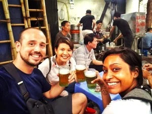 Private Siem Reap street food tour by tuk-tuk with local guide serving traditional Khmer dishes at night market stalls.